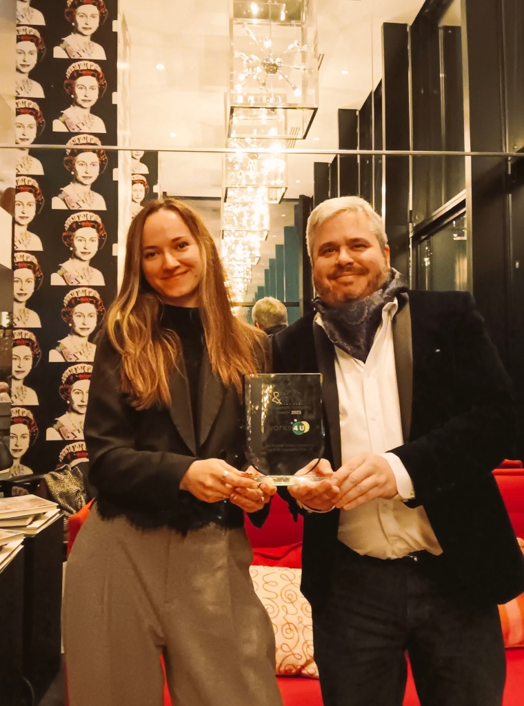 Martyna Bielecka and Dominic Pinkney from Works4U celebrate with their winners trophy from Wealth & Finance International Management Consulting Awards 2023